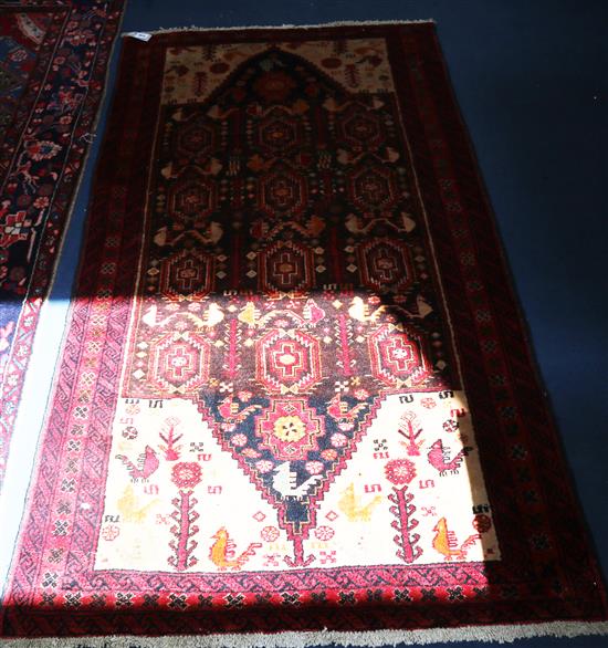 A Persian Kazak red ground rug, 200 x 100cm